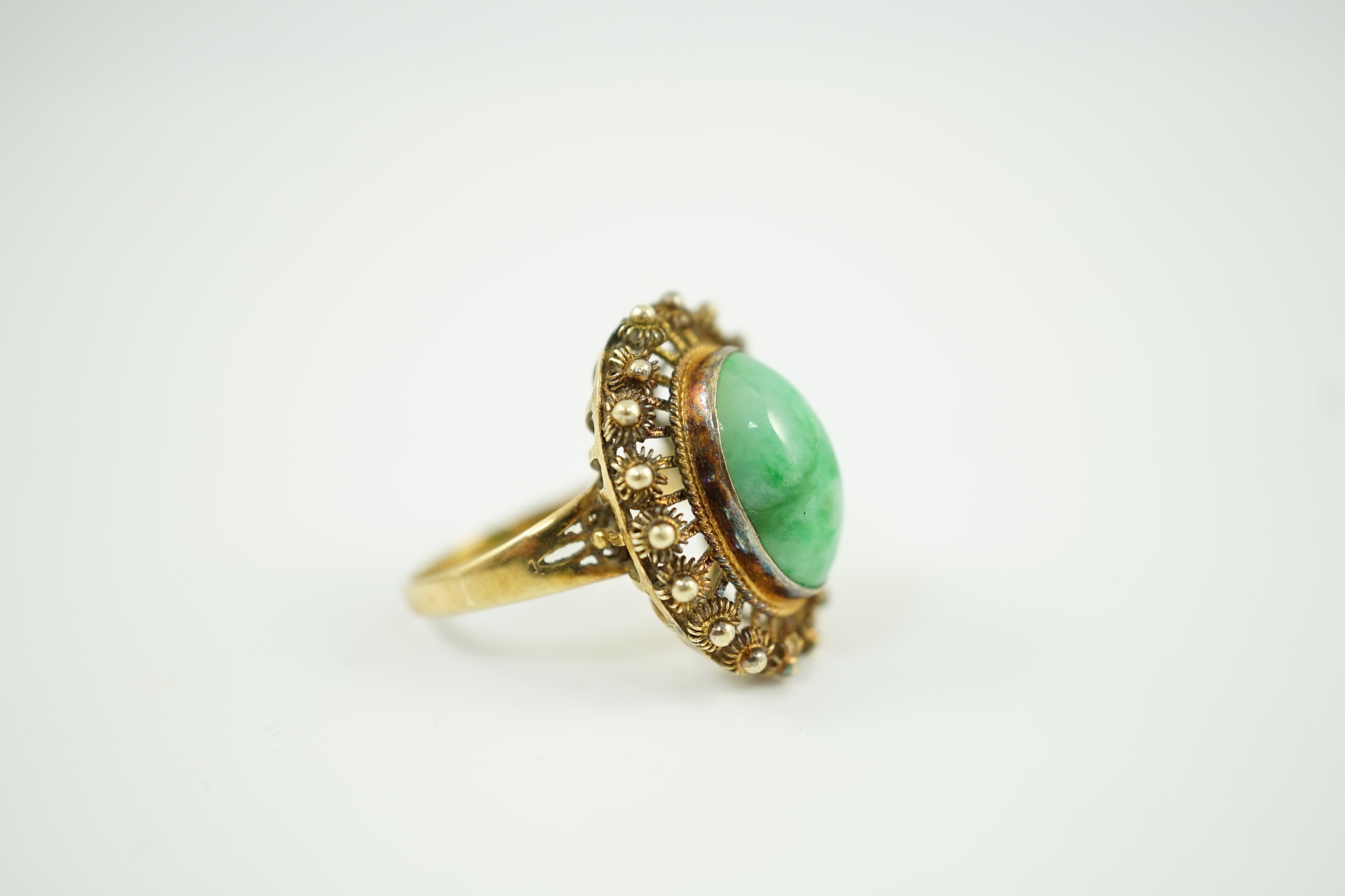 A Chinese? 14k yellow metal and cabochon jadeite set dress ring, size N, gross weight 6.3 grams.
